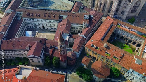 Aerial view of Royal Palace Palazzo Reale and Piazza Duomo. Chiesa di San Gottardo in Corte. Green lawns in the courtyards of the palazzo. Krish and the bell tower of the church. Milan Italy 07.2023 photo