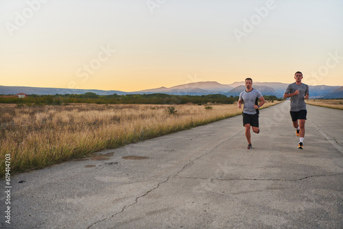 Group of handsome men running together in the early morning glow of the sunrise  embodying the essence of fitness  vitality  and the invigorating joy of embracing nature s tranquility during their