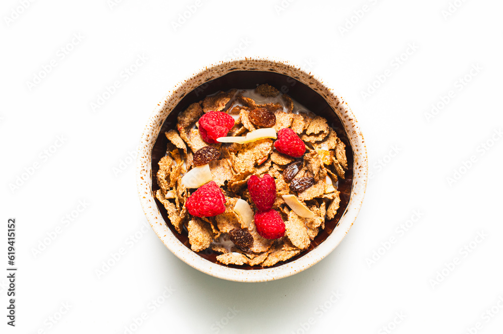 Muesli with raspberries and milk in a bowl on a white background. Healthy breakfasts, proper nutrition Muesli with raspberries and milk in a bowl on a white background. Healthy breakfasts, proper nutrition