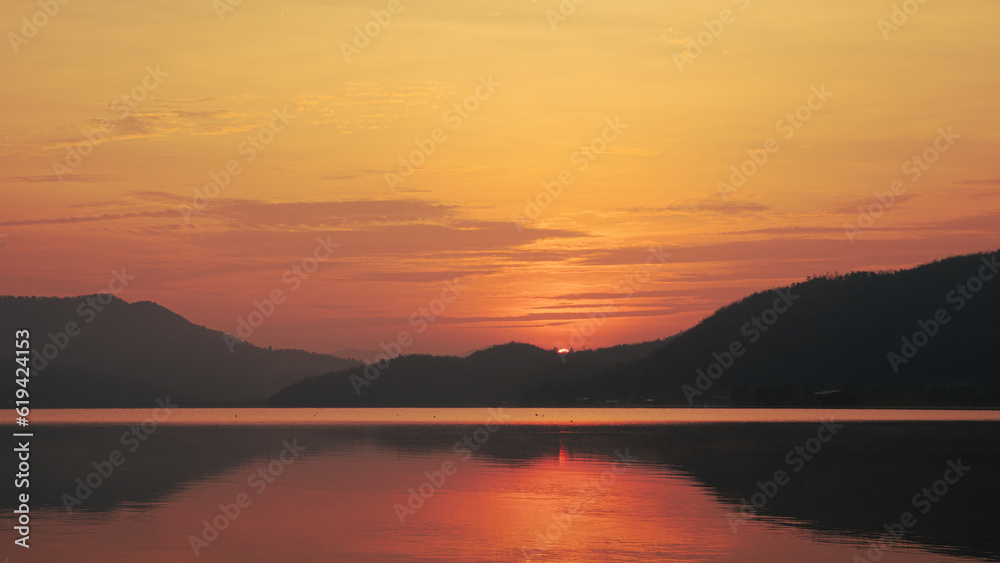Sunrise time at lake or river with mountain