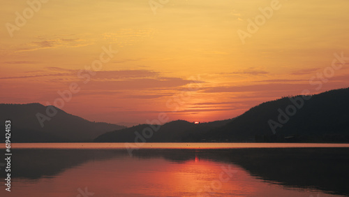Sunrise time at lake or river with mountain © Phongsak