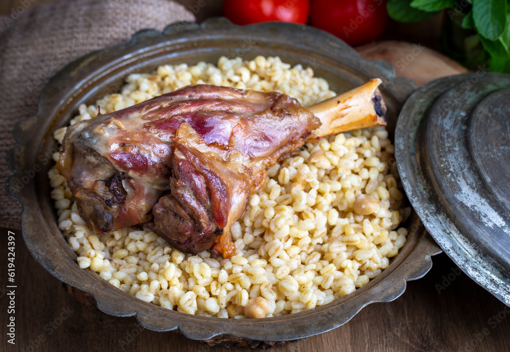 Turkish foods; lamb shank tandoori on bulgur wheat rice (Turkish name ...