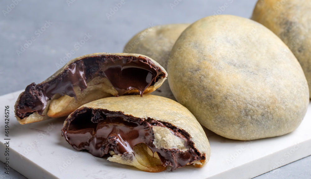 Bomb famous chocolate of Izmir. Chocolate inside thin baked dough. Turkish name is bomba. Izmir famous chocolate concept photo.