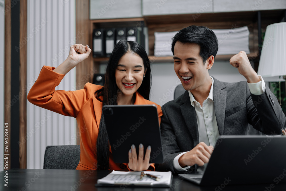 Happy smiling businessman feel happy work complete Teamwork success, success at work in the office concept. Happy smiling businessman feel happy work complete Teamwork success, success at work in the office concept.
