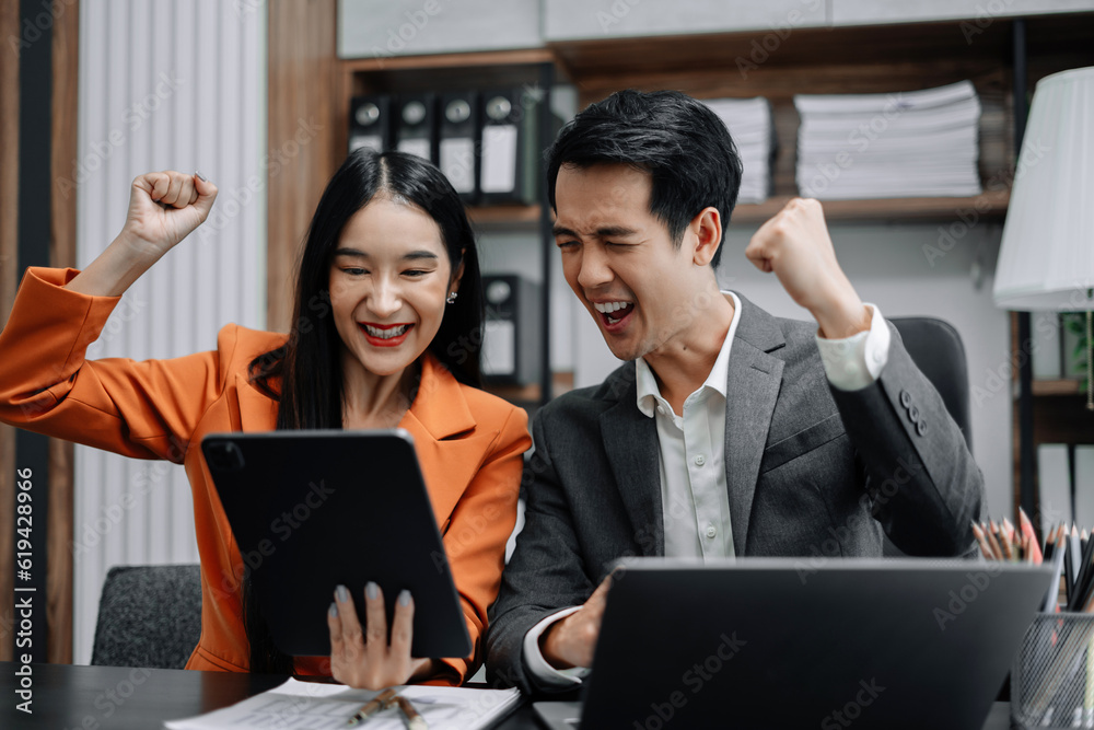 Happy smiling businessman feel happy work complete Teamwork success, success at work in the office concept. Happy smiling businessman feel happy work complete Teamwork success, success at work in the office concept.