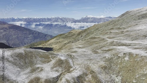 Snowy ascent to Col de Cou, view into the main valley and the Valais Alps, drone shot, Val dHerens, Valais, Switzerland, Europe photo