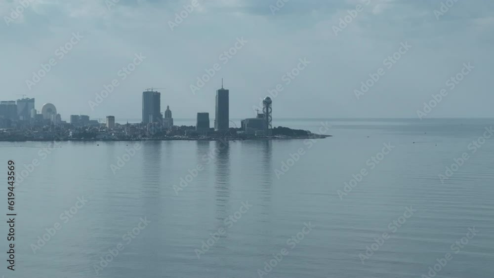 Aerial shot of Ferris wheel, alphabetic tower, skyscrapers and embankment of Batumi city Aerial shot of Ferris wheel, alphabetic tower, skyscrapers and embankment of Batumi city