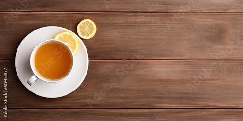 Refreshing and healthy summer drink. Iced tea with fresh lemon on wooden table, freshness and organic goodness in glass cup with copy space for your designs