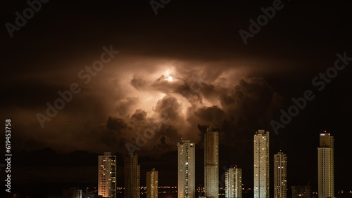 Majestic Lightning Storm over Urban Skyscrapers at Night