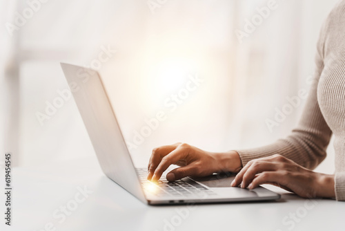 Fototapete Close-up portrait typing keyboard on laptop computer