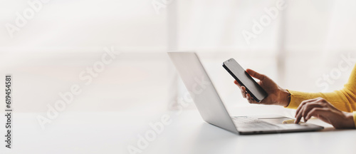 Type search information from the Internet network. Businessman working with smartphone, tablet and laptop computer on table in office. network concept photo