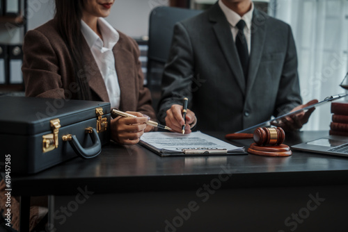 Lawyer explaining legal situation businessperson asian people working in b2b interview, networking or law firm agreement, Infringement of copyright, Embezzlement, Donee, Liquidator, Defunct Company.