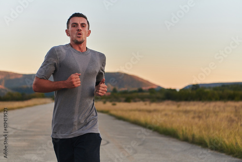 A young handsome man running in the early morning hours, driven by his commitment to health and fitness