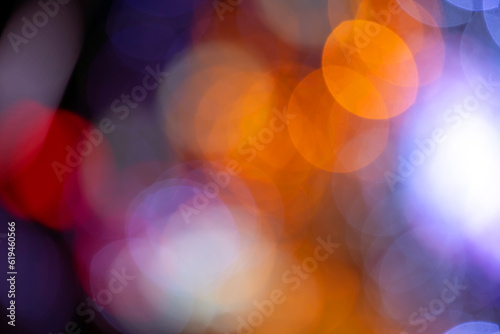 background blurred abstraction of colored lanterns and decorations. bokeh texture of street colored lights photo
