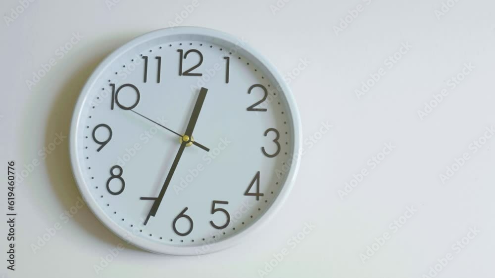 Closeup of White Clock Face in timelapse hanging on the wall in daytime of office, Passing time never stops. Running pointer Closeup of White Clock Face in timelapse hanging on the wall in daytime of office, Passing time never stops. Running pointer