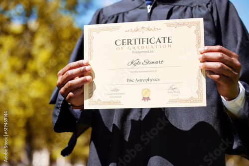 College, hands and closeup of a graduation diploma for success, achievement or goal. Scholarship, college and zoom of graduate, student or person holding degree or diploma scroll for education photo