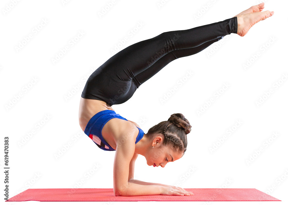 Young woman practicing yoga on fitness mat