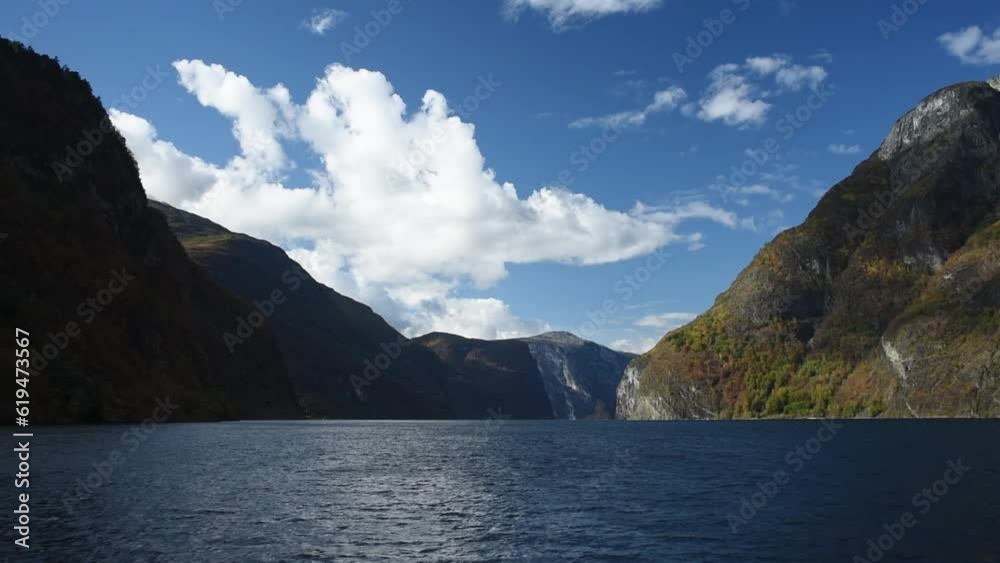 View from an electrical cruise ship on Sognefjord, Aurlandsfjord Flam, Norway. Impressive mountain landscape of fjords and blue water View from an electrical cruise ship on Sognefjord, Aurlandsfjord Flam, Norway. Impressive mountain landscape of fjords and blue water
