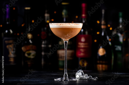 Wallpaper Mural Rattlesnake alcoholic cocktail drink with coffee and cocoa liquor, irish cream, ground coffee and ice in glass, dark bar counter background, bar tools and bottles Torontodigital.ca