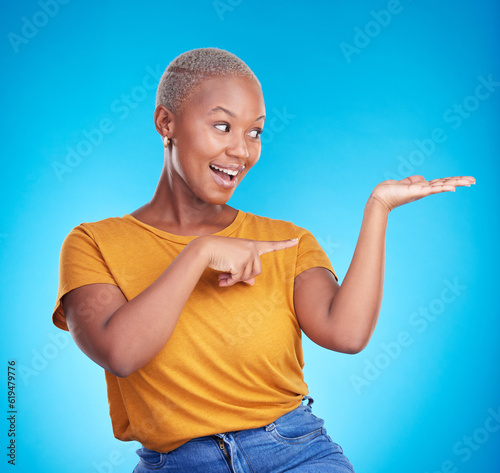 Decision, choice and black woman showing, presentation and information against a blue studio background. Discount deal, female person and excited model with options, advertising and product placement