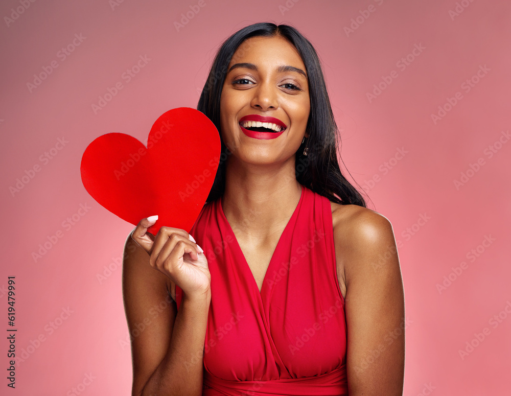 Portrait, heart and social media with a woman on a pink background in studio for love or romance. Smile, emoji and valentines day with a happy young female holding a shape or symbol of affection Portrait, heart and social media with a woman on a pink background in studio for love or romance. Smile, emoji and valentines day with a happy young female holding a shape or symbol of affection