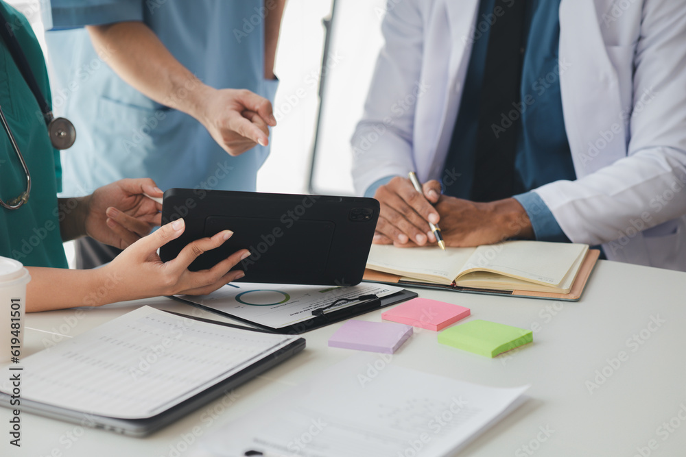 A conference room in a hospital where a group of doctors are attending a meeting, a meeting of executive doctors and chiefs meeting with pharmaceutical dealers. Doctor meeting concept. A conference room in a hospital where a group of doctors are attending a meeting, a meeting of executive doctors and chiefs meeting with pharmaceutical dealers. Doctor meeting concept.