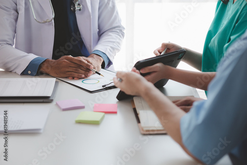A conference room in a hospital where a group of doctors are attending a meeting, a meeting of executive doctors and chiefs meeting with pharmaceutical dealers. Doctor meeting concept.