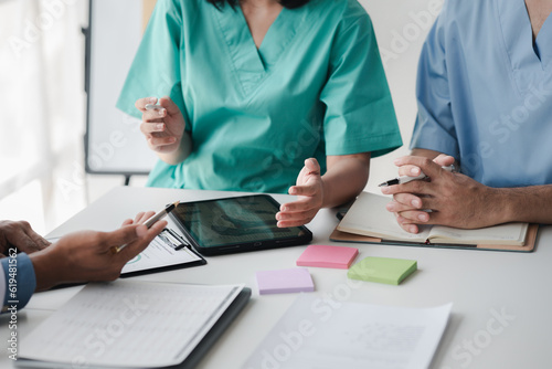A conference room in a hospital where a group of doctors are attending a meeting, a meeting of executive doctors and chiefs meeting with pharmaceutical dealers. Doctor meeting concept.