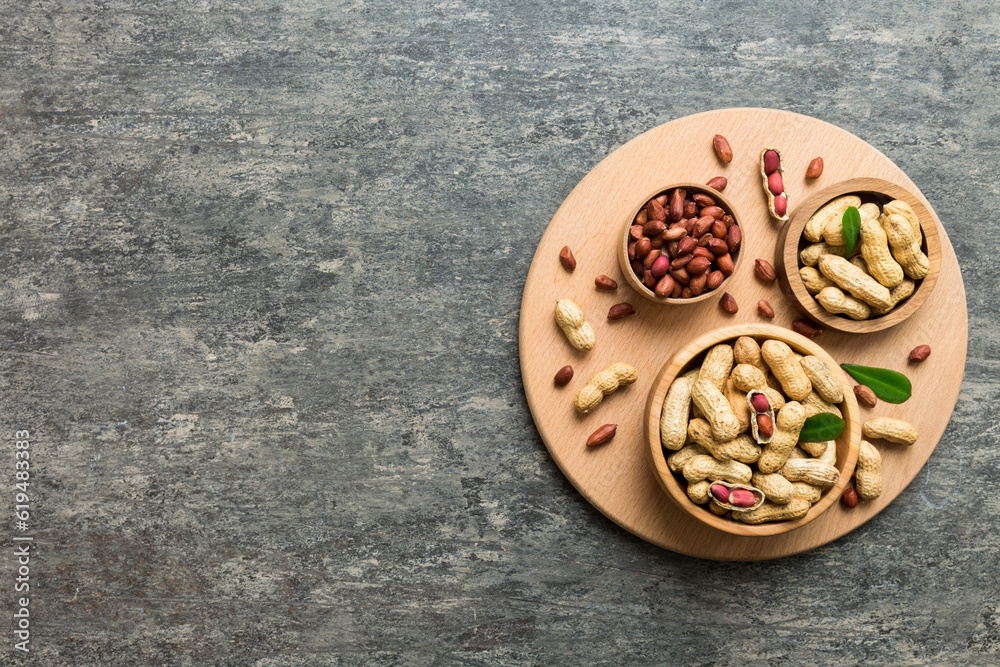 Fresh healthy peanuts in bowl on colored table background. Top view Healthy eating bertholletia concept. Super foods Fresh healthy peanuts in bowl on colored table background. Top view Healthy eating bertholletia concept. Super foods