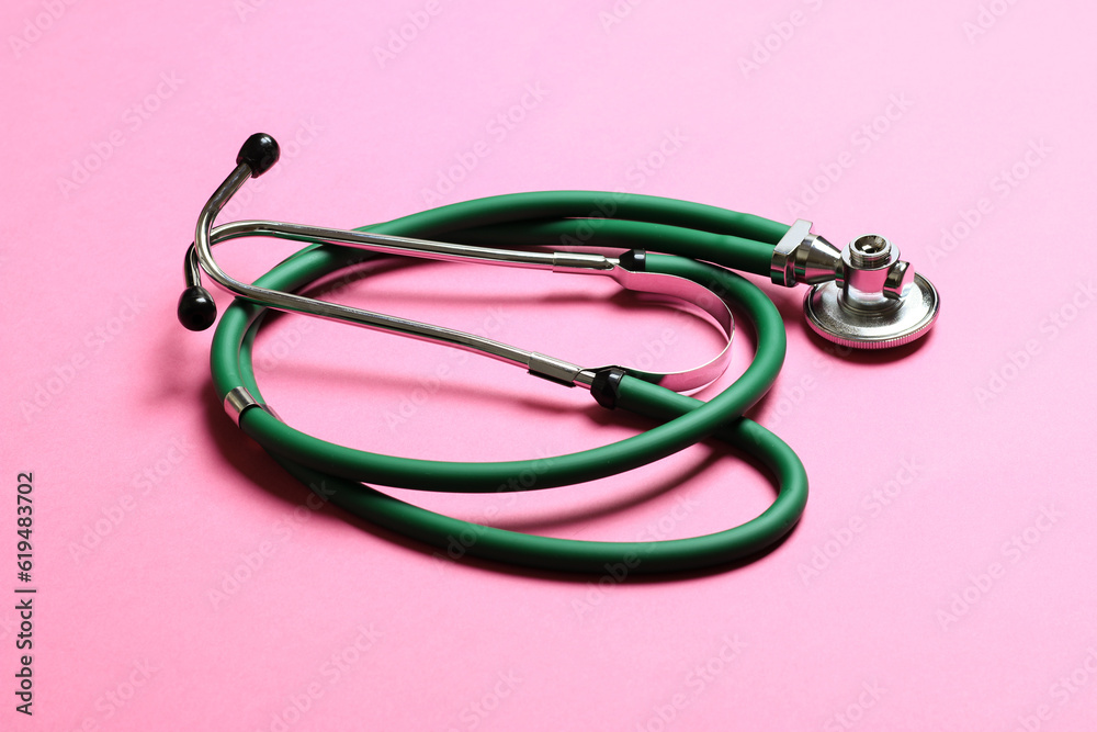 Top view of green medical stethoscope on colorful background with copy space. Medicine equipment concept Top view of green medical stethoscope on colorful background with copy space. Medicine equipment concept