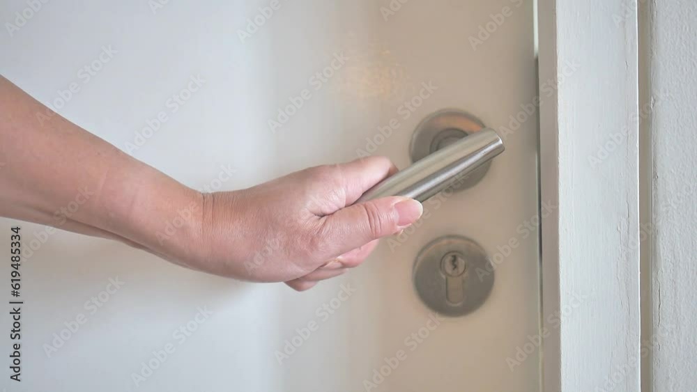 Female hand opening white wooden door, business, hotel, house, condominium, apartment, resident, holding door handle, travel concept, tourist, selling, buying, rental, Full HD video motion