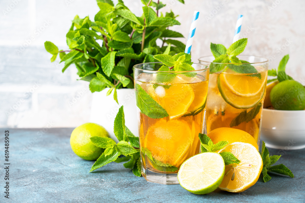Fototapeta premium Iced tea with lemon, lime, mint and ice.