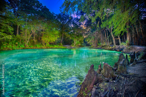 Fototapeta Naklejka Na Ścianę i Meble -  Night Illumination of Citrus Blue Springs (Big Blue Springs) on Withlacoochee River, Florida