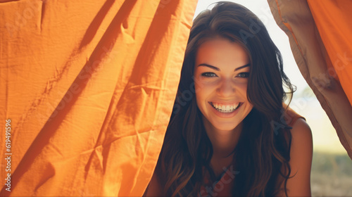 person in a tent  woman in tent  young beautiful woman in orange tent  generative ai