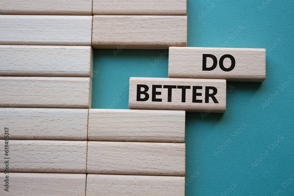 Do better symbol. Wooden blocks with words Do better. Beautiful grey green background. Business and Do better concept. Copy space. Do better symbol. Wooden blocks with words Do better. Beautiful grey green background. Business and Do better concept. Copy space.