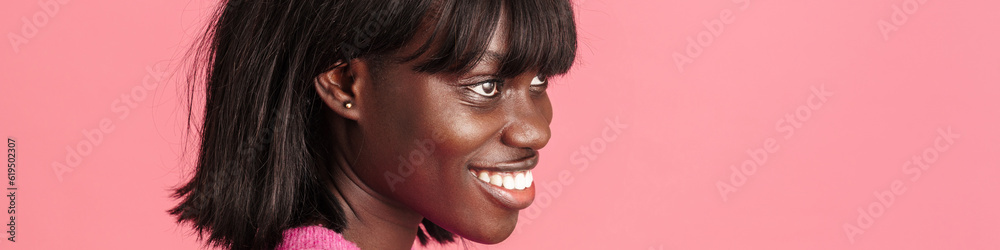 Profile portrait of young beautiful smiling african woman Profile portrait of young beautiful smiling african woman