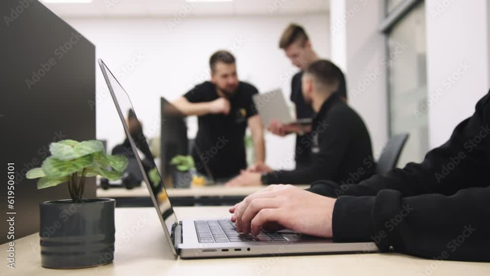 Group of businesspeople, mates involved in teamwork use laptop, look at device screen, consider new business program, corporate software, look interested, engaged in collaborative project discussion