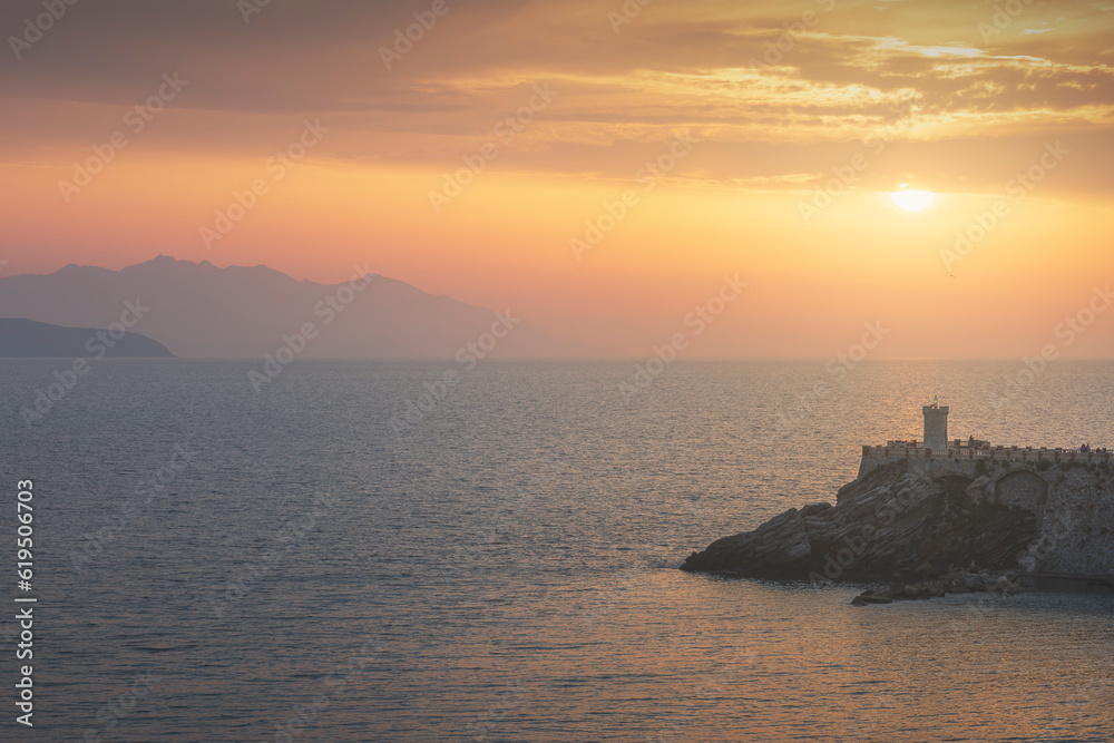 View of Piazza Bovio in Piombino at sunset and Elba island in the background. Tuscany Italy
