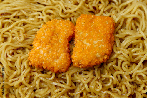Cooked Noodles on the whole frame. close up of delicous noodles with chicken nuggets