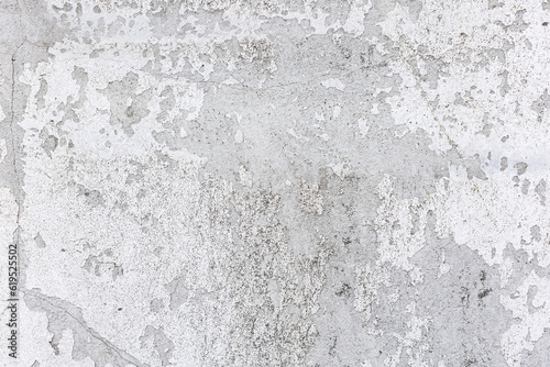 White Street Wall Texture Background. Painted Distressed Wall Surface. Grunge Background. Shabby Building Facade With Damaged Plaster. 