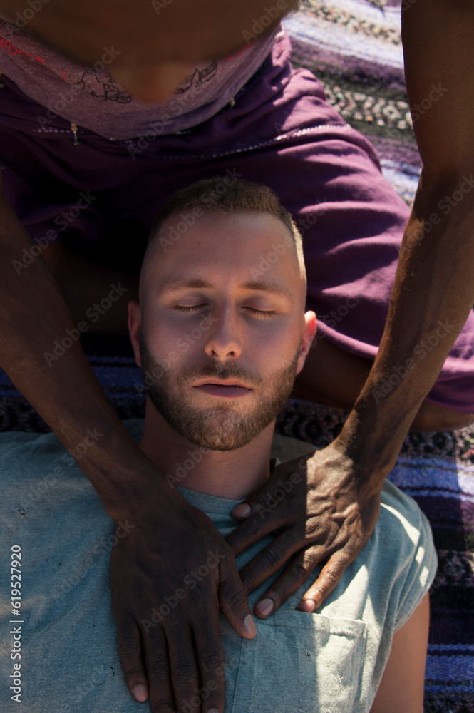 Photographs of a young black gay man practicing Reiki in the desert. Photographs of a young black gay man practicing Reiki in the desert.