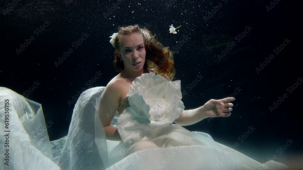 beautiful woman in white dress and topless floating underwater, sexuality and beauty of female body beautiful woman in white dress and topless floating underwater, sexuality and beauty of female body