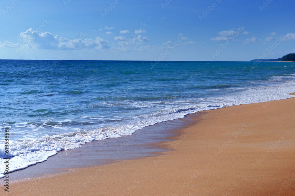 Light blue sea waves and island on clean sandy beach, Tropical white sand beach and soft sunshine background
