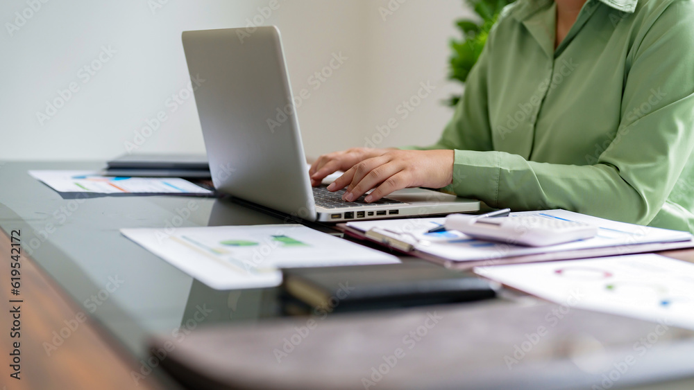 Close up Millennial confident Female working in creative office.