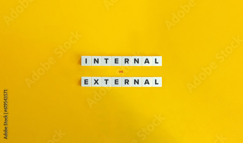 Internal vs. External Locus of Control. Letter Tiles on Yellow Background. Minimal Aesthetic. photo