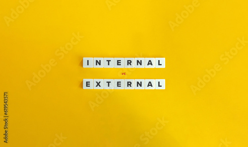 Internal vs. External Locus of Control. Letter Tiles on Yellow Background. Minimal Aesthetic.