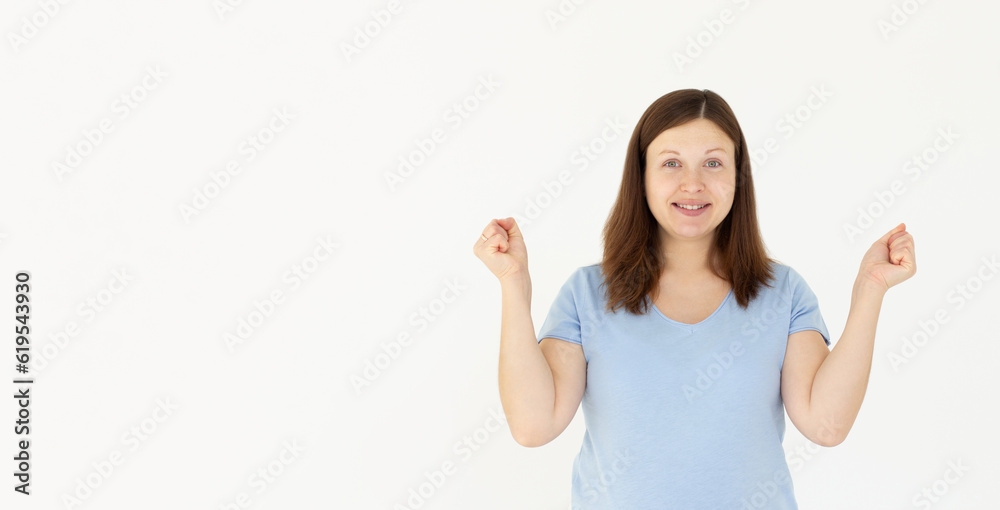 Enthusiastic woman rejoicing, say yes, looking happy and celebrating victory, champion dance, fist pump gesture, standing over white background Enthusiastic woman rejoicing, say yes, looking happy and celebrating victory, champion dance, fist pump gesture, standing over white background