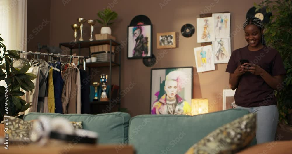 African woman interior designer, working with attention to detail ...