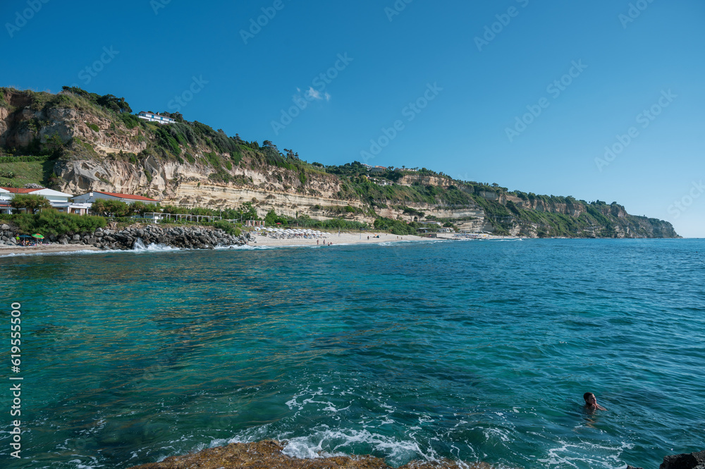 Italy, July 2023: wonderful and relaxing view of the bay of Riaci with its cliffs and crystalline sea. We are near Tropea along the Costa degli Dei in the Calabria region