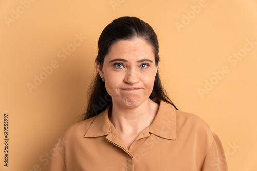 unhappy caucasian woman with sad face expression in studio shot. frustration, unhappy, problem concept.